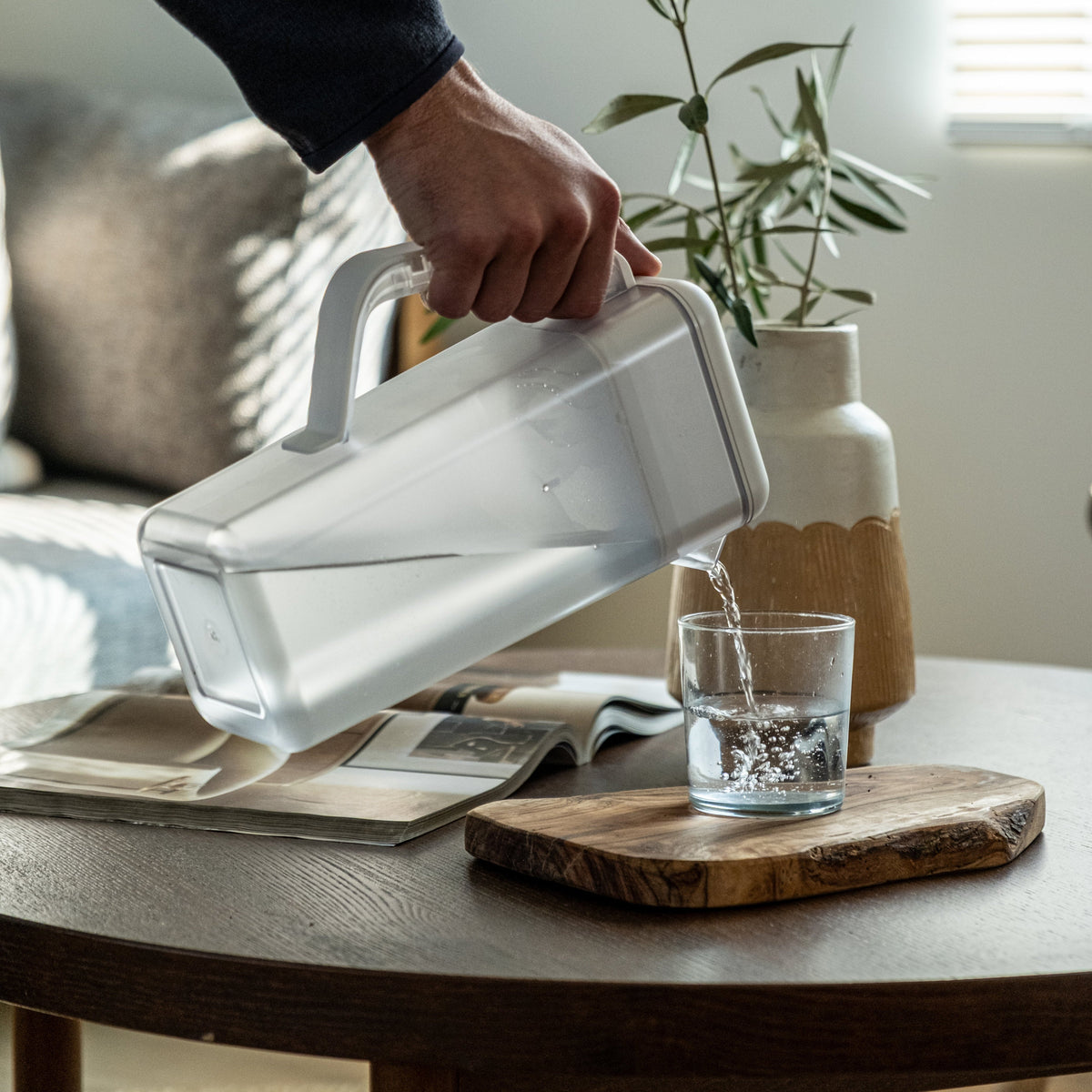 Pouring from the Always Fresh Pitcher at a living-room table