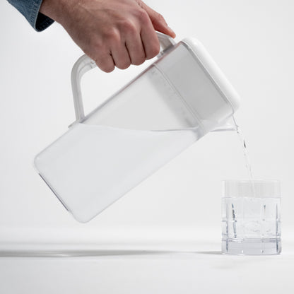 Pouring water from the Always Fresh Pitcher into a glass